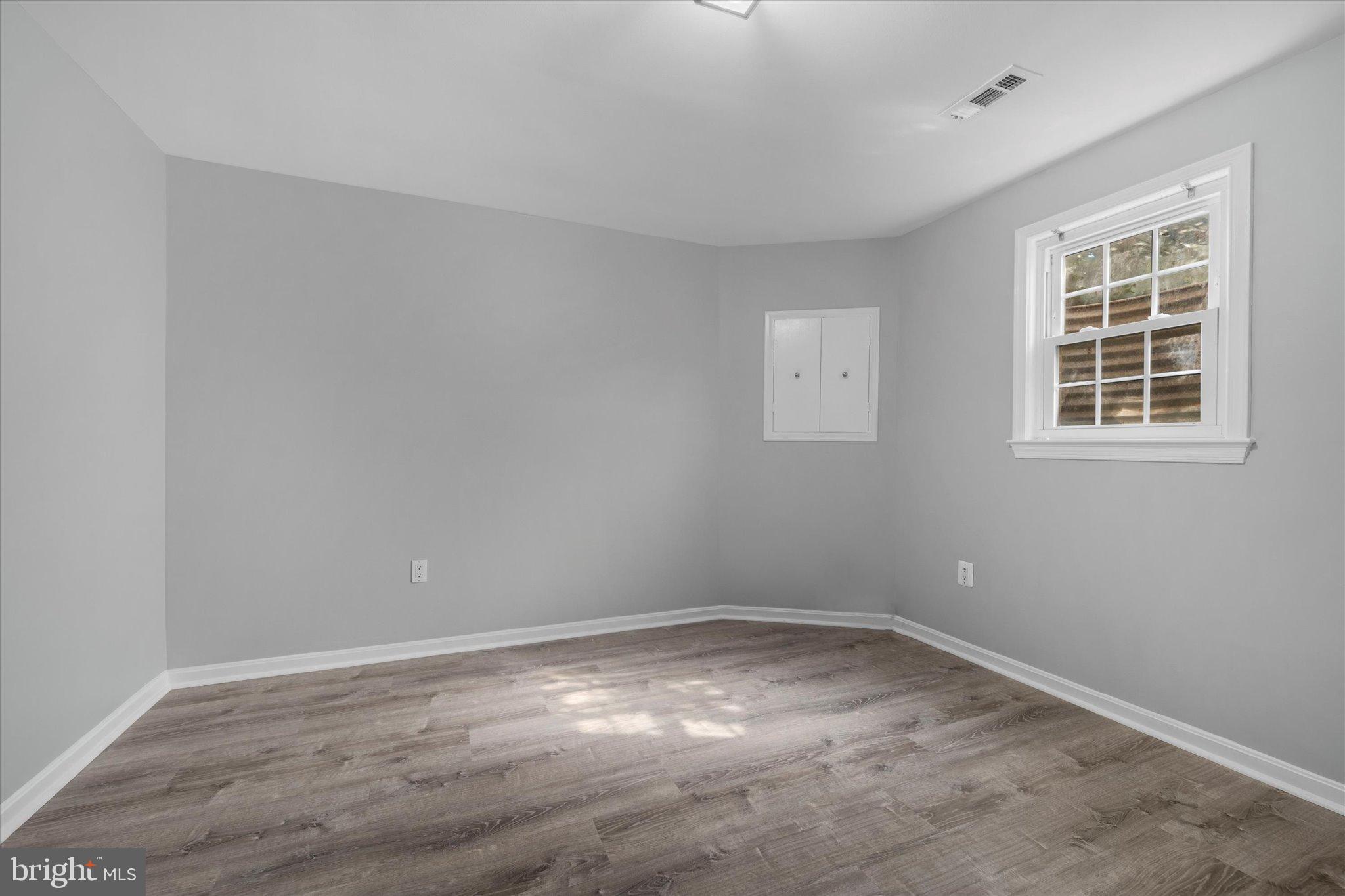 10276 Arizona Circle, Unit 61 Bethesda, MD 20817 - Photo 30 of 42 an empty room with a window
