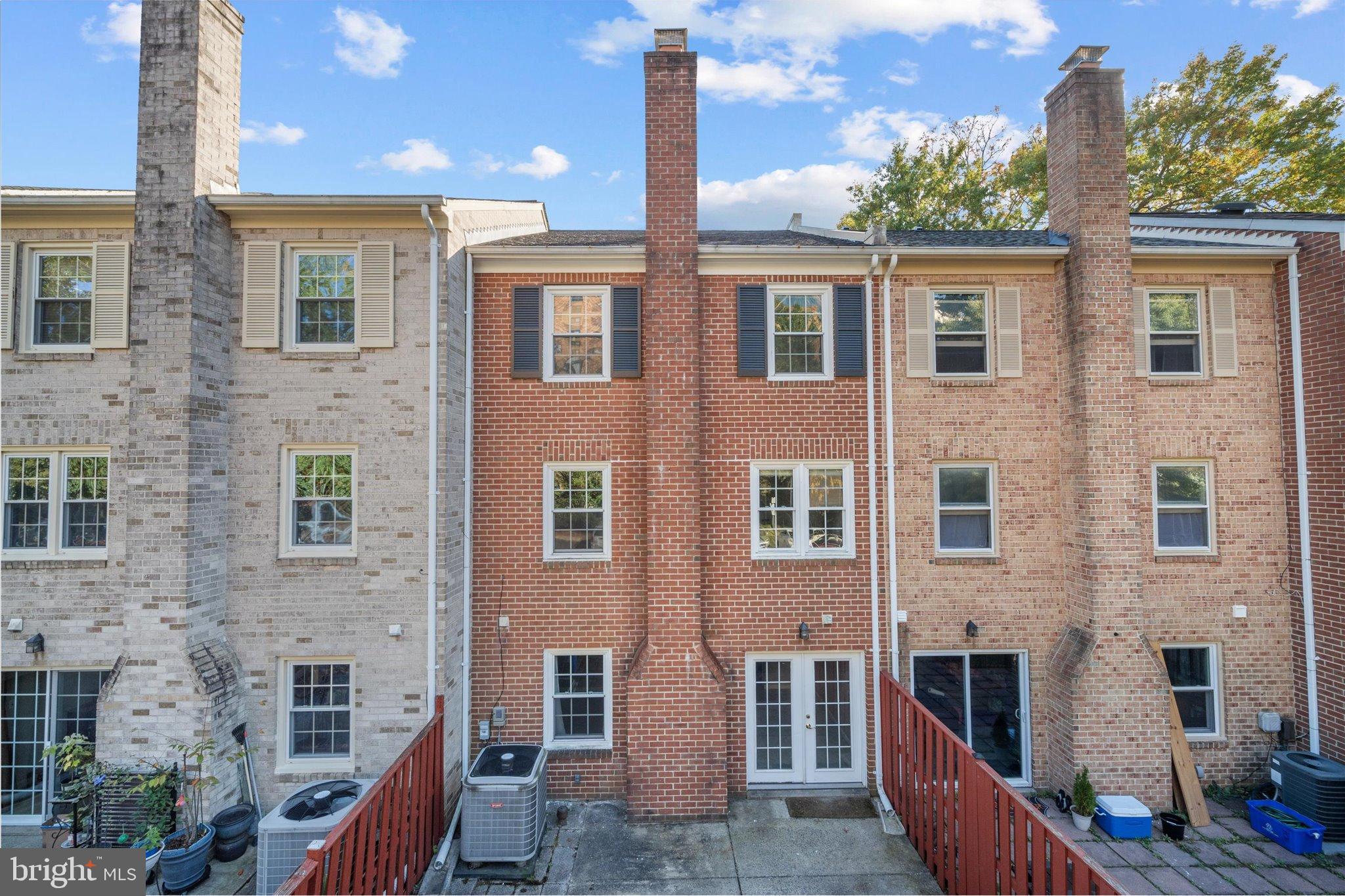 10276 Arizona Circle, Unit 61 Bethesda, MD 20817 - Photo 36 of 42 a front view of a building with glass windows