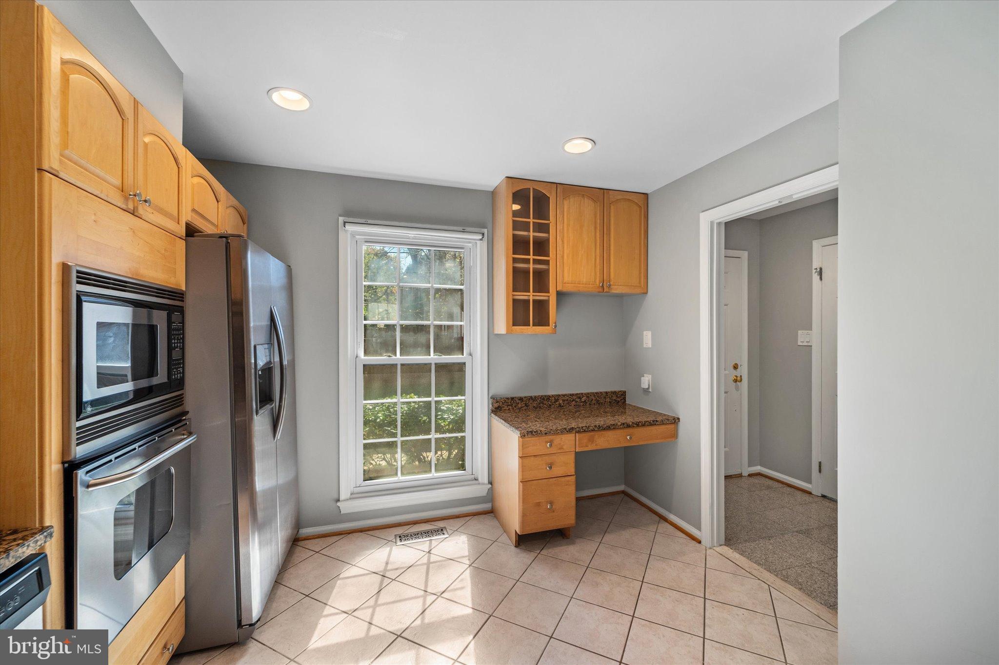 10276 Arizona Circle, Unit 61 Bethesda, MD 20817 - Photo 7 of 42 a view of kitchen with furniture and a refrigerator