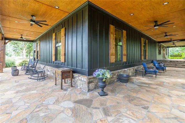 a living room with lots of furniture and a chandelier