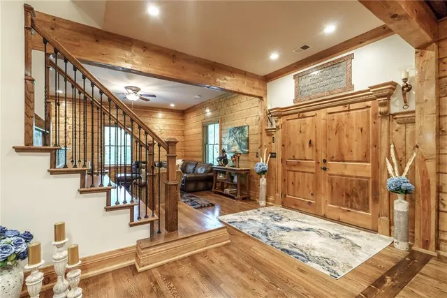 a large kitchen with lots of counter space and dining table