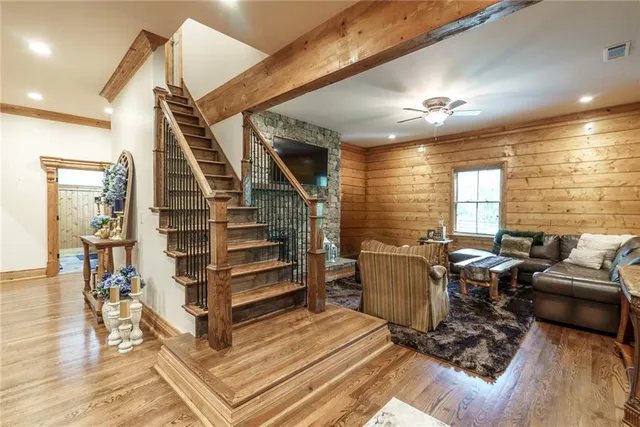 a kitchen with stainless steel appliances granite countertop a sink table and chairs