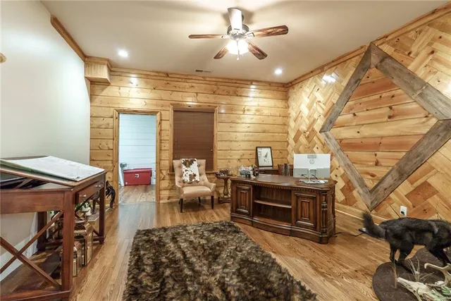 a bedroom with furniture and a large window