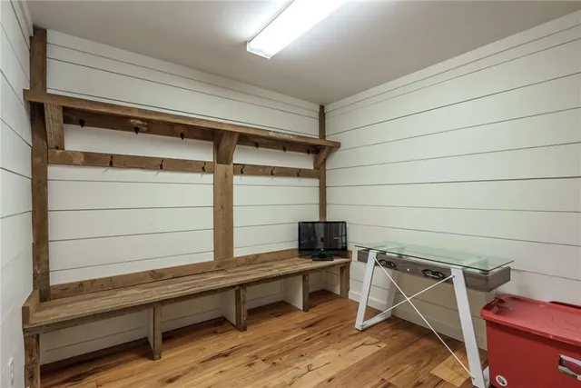 a bedroom with two beds and a chandelier