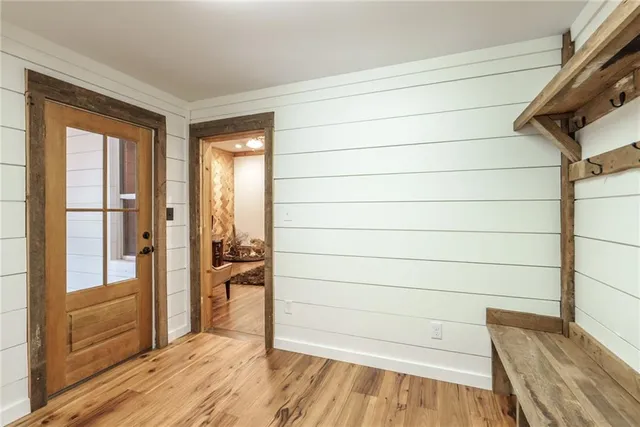 a bedroom with furniture and a flat screen tv