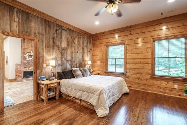 a bedroom with a bed and a mirror