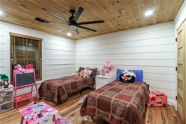 a view of a backyard with plants and a patio