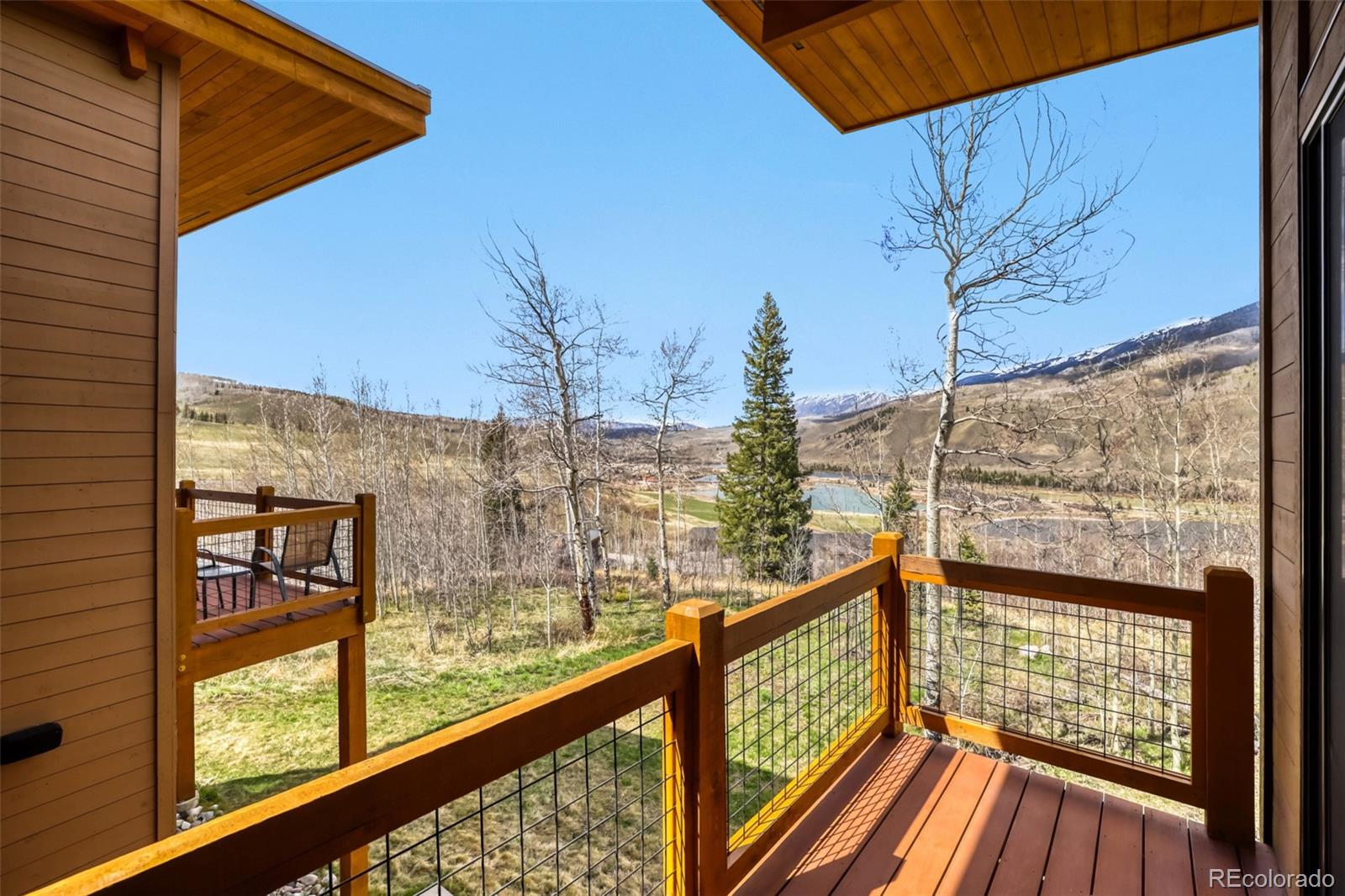 836 Maryland Creek Road Silverthorne, CO 80498 - Photo 24 of 49 a view of a balcony with wooden floor and fence