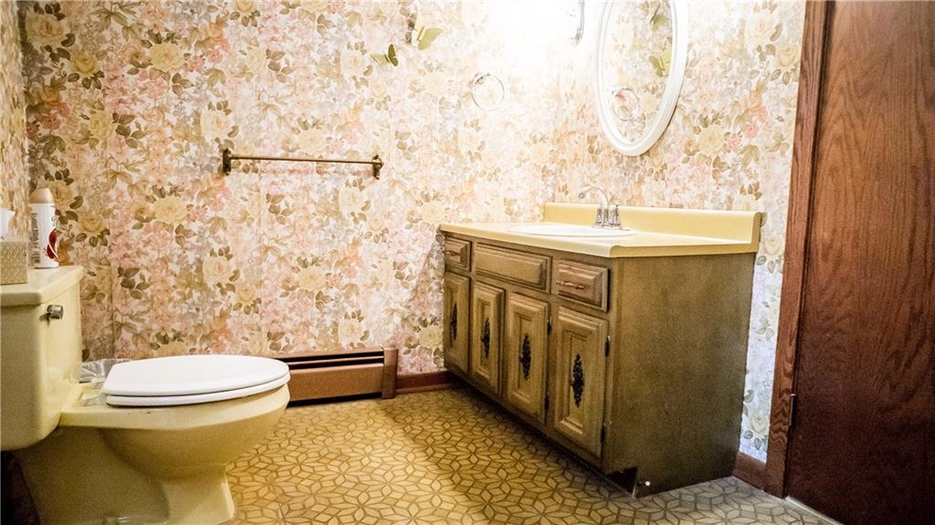 251 Welsh Road Valencia, PA 16059 - Photo 12 of 25 A Vintage Bathroom with Neutral Tones, Accented by Wooden Trim