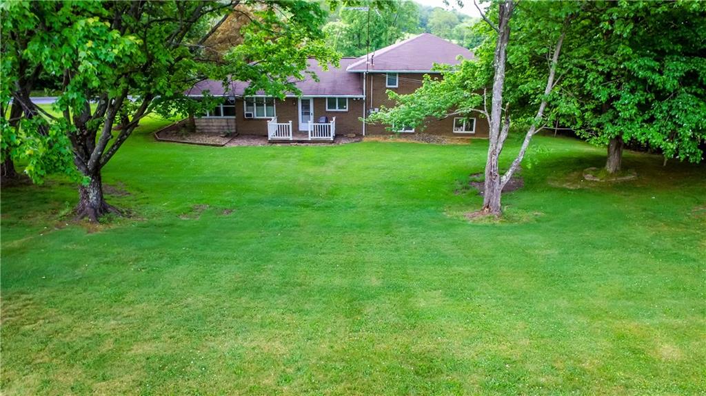 251 Welsh Road Valencia, PA 16059 - Photo 24 of 25 Beautifully Manicured Yard Complimenting Back Entrance