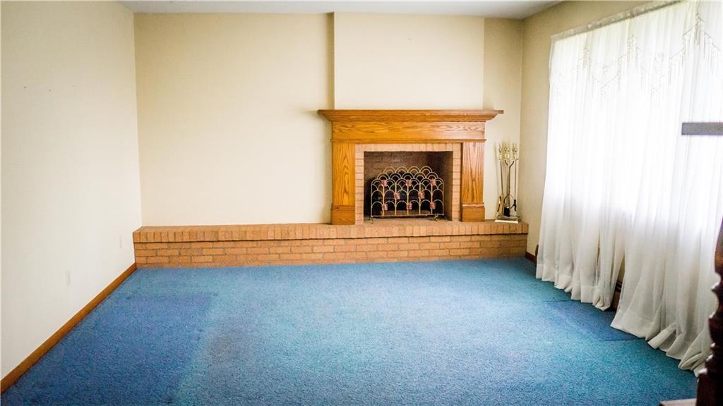 251 Welsh Road Valencia, PA 16059 - Photo 4 of 25 Classic Wooden Fireplace A Centerpiece in this Spacious 13x11 Living Room