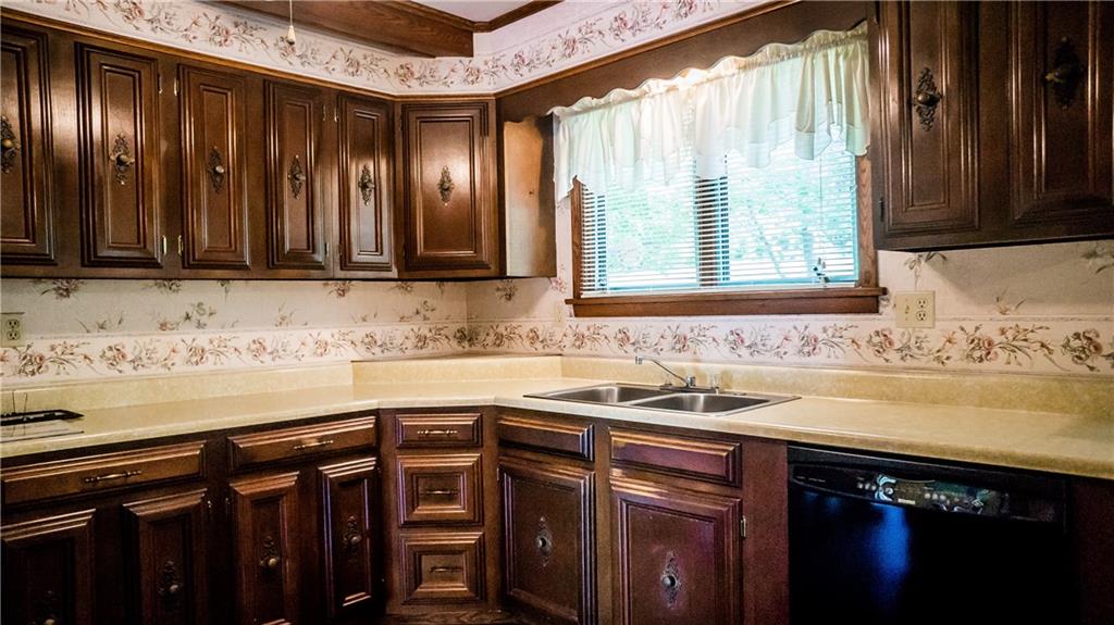 251 Welsh Road Valencia, PA 16059 - Photo 8 of 25 Beautiful Vintage Cabinetry Decorate the Kitchen, Accented by a Cream Colored Counter Top
