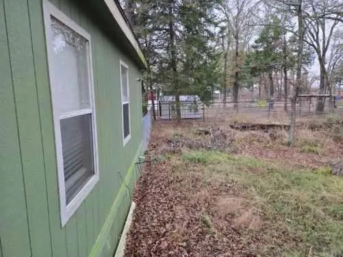 a backyard of a house with lots of green space