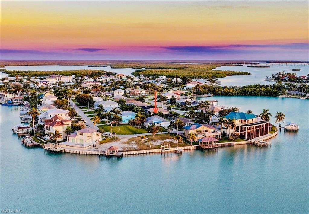 Aerial view at dusk of a residential view and a water view
