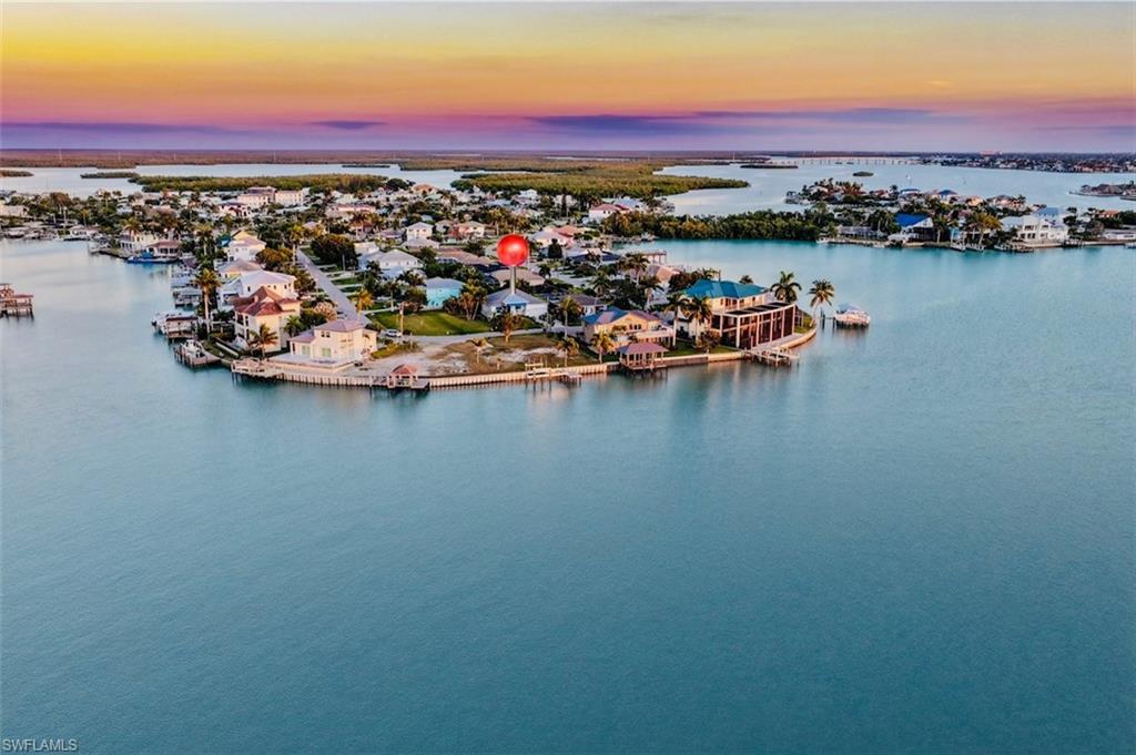 161 Tahiti Circle Naples, FL 34113 - Photo 38 of 42 Aerial view at dusk of a water view