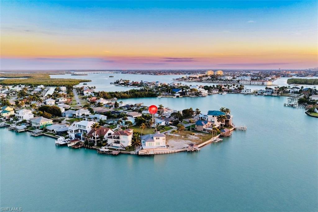 161 Tahiti Circle Naples, FL 34113 - Photo 39 of 42 Aerial view at dusk of a residential view and a water view