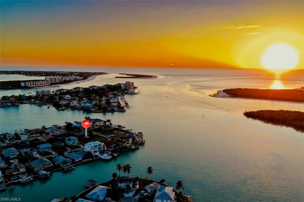 161 Tahiti Circle Naples, FL 34113 - Photo 40 of 42 Aerial view at dusk of a water view