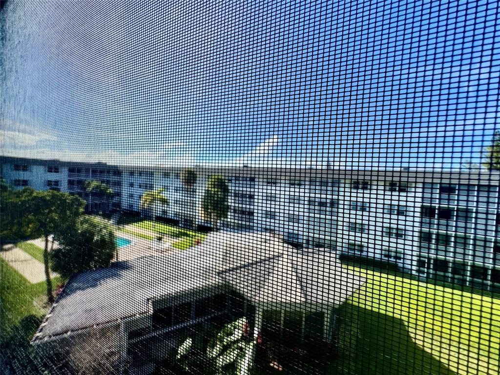 800 East Camino Real, Unit PH4160 Boca Raton, FL 33432 - Photo 13 of 22 a view of a room with wooden floor