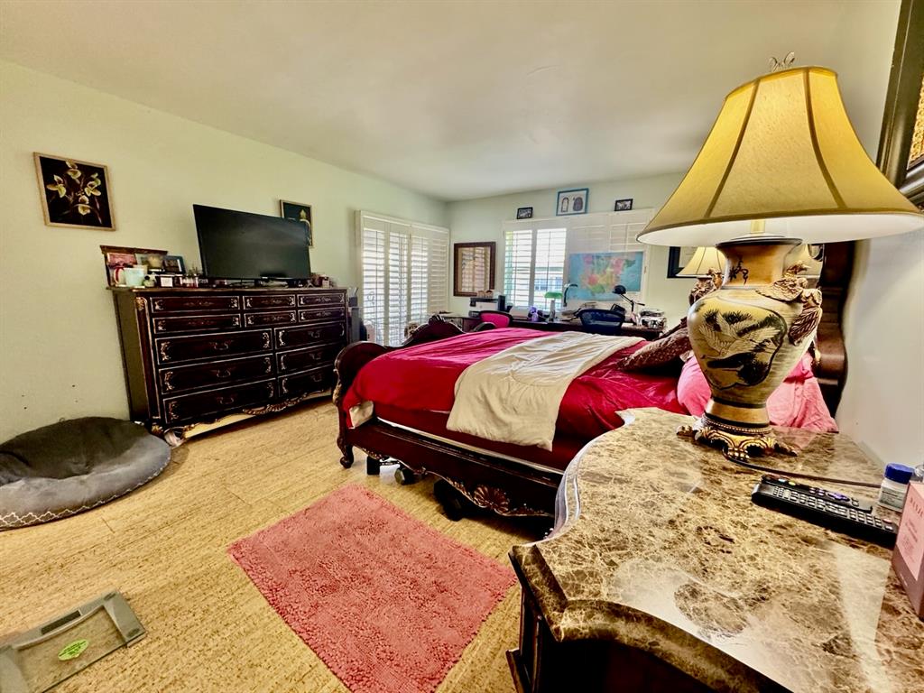 800 East Camino Real, Unit PH4160 Boca Raton, FL 33432 - Photo 15 of 22 a bedroom with a bed and a flat screen tv