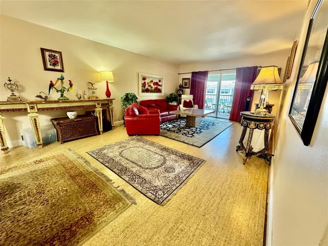 a bed room with a bed furniture and a flat screen tv