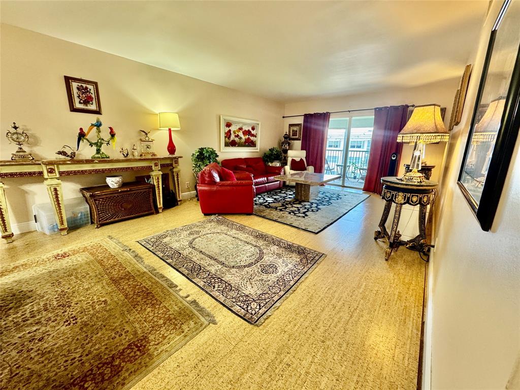 800 East Camino Real, Unit PH4160 Boca Raton, FL 33432 - Photo 3 of 22 a bed room with a bed furniture and a flat screen tv