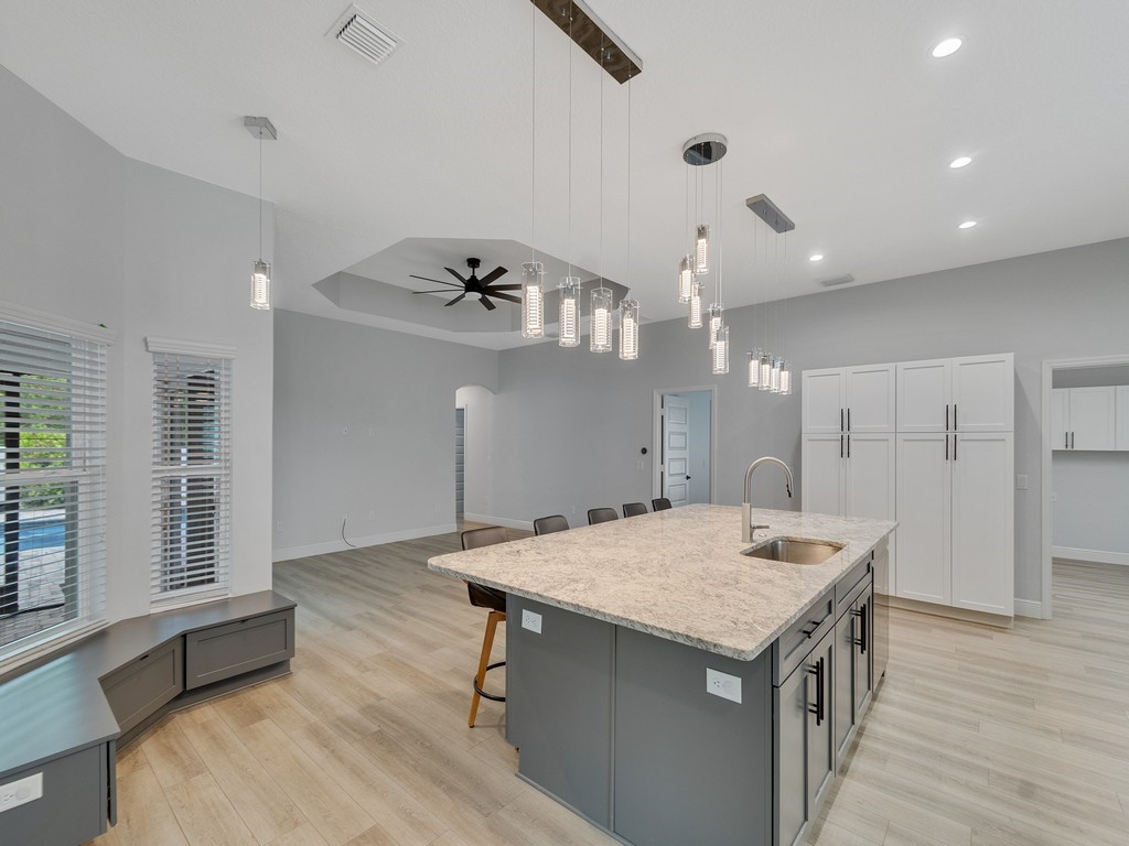 431 Midvale Terrace Sebastian, FL 32958 - Photo 11 of 34 an open kitchen with a table and chairs in it