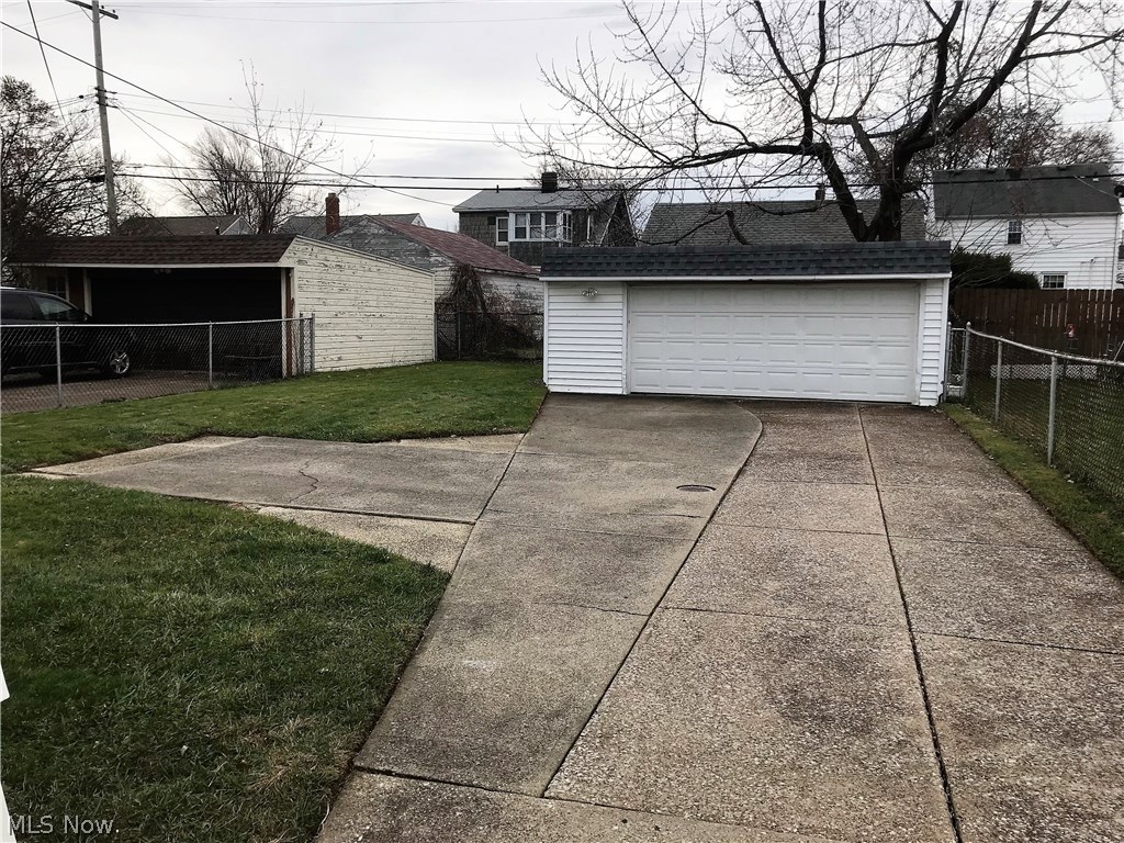 8219 Snow Road Parma, OH 44129 - Photo 22 of 22 Super-sized 2.5 car garage plus driveway has side-pad for extra parking and easy turn-around.