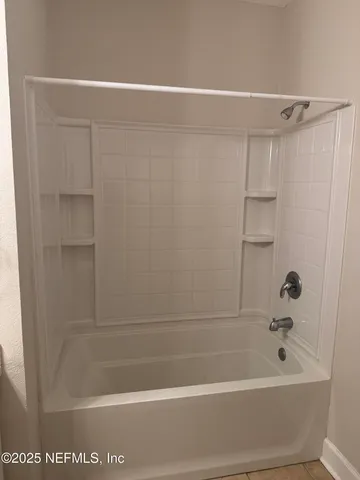 a front view of a house with a yard table and chairs