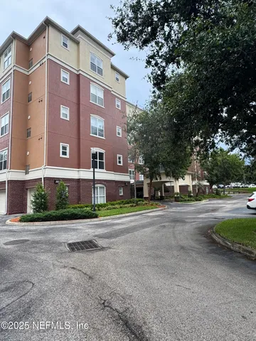 a view of a building with a street