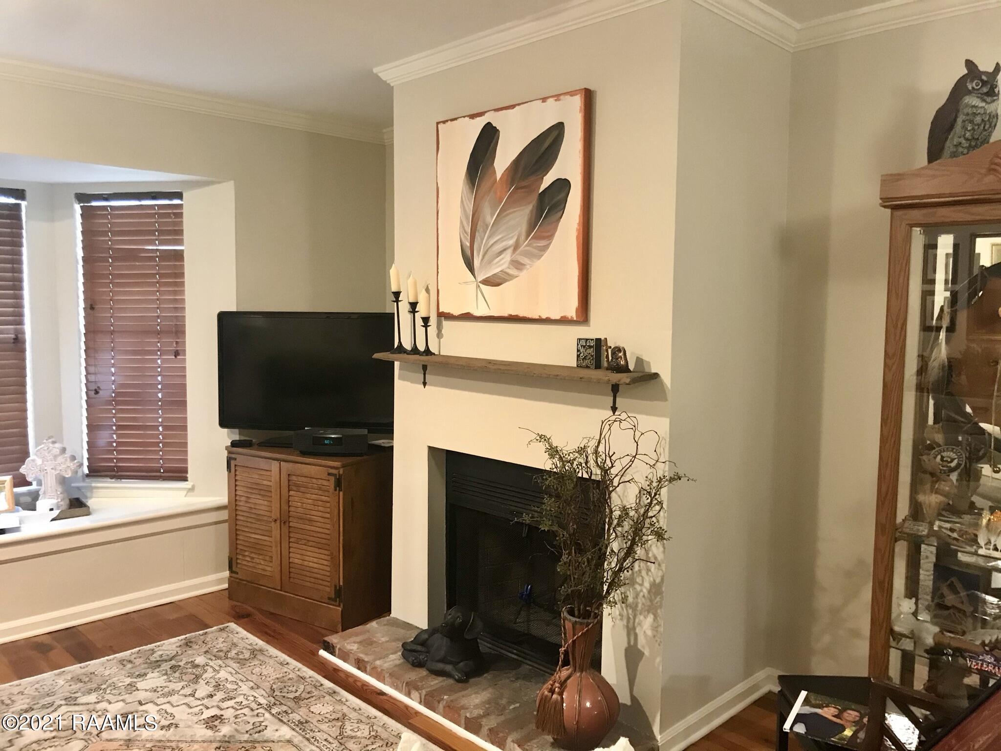 465 Rena Drive, Unit 465 Lafayette, LA 70503 - Photo 2 of 15 Living room fireplace