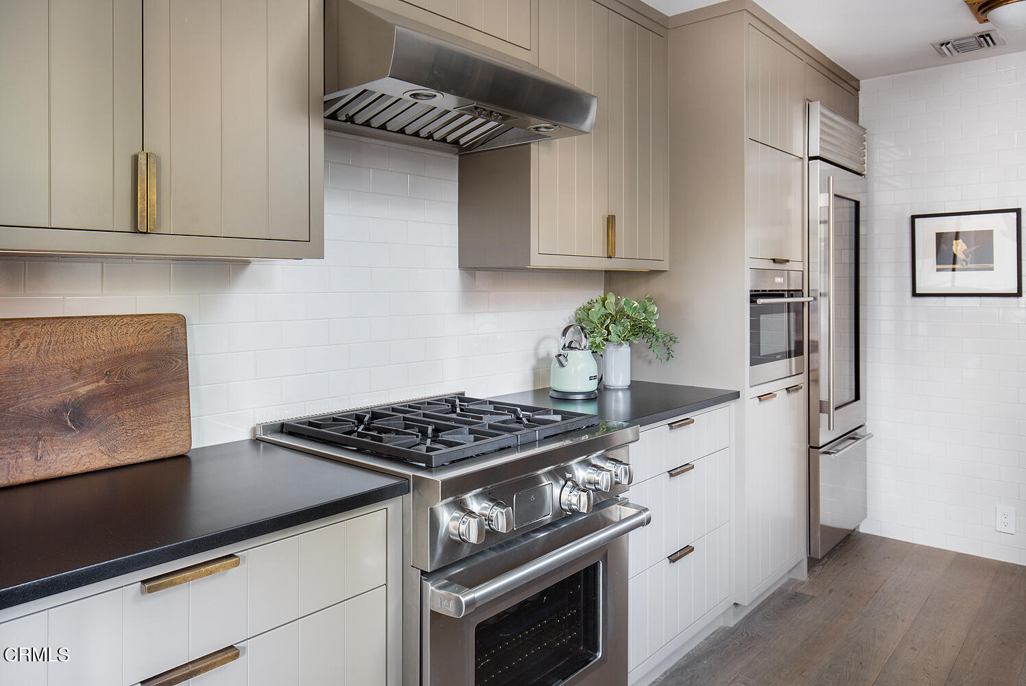 1146 Wotkyns Drive Pasadena, CA 91103 - Photo 24 of 63 a kitchen with stainless steel appliances granite countertop a stove a refrigerator and a microwave
