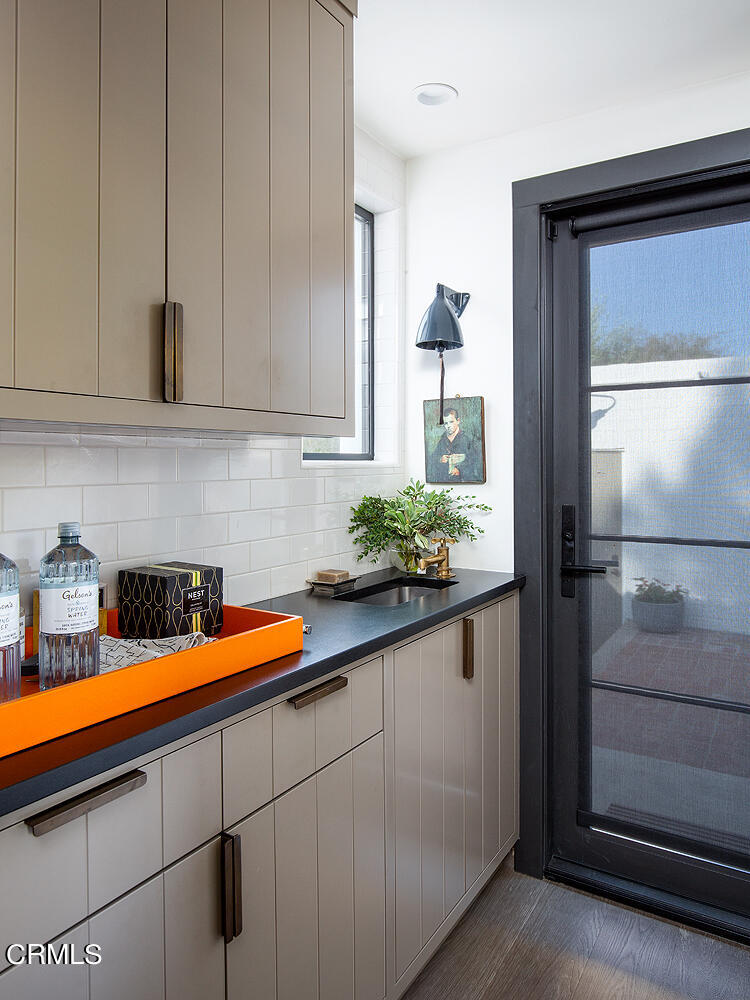1146 Wotkyns Drive Pasadena, CA 91103 - Photo 27 of 63 a kitchen with stainless steel appliances granite countertop a sink and cabinets