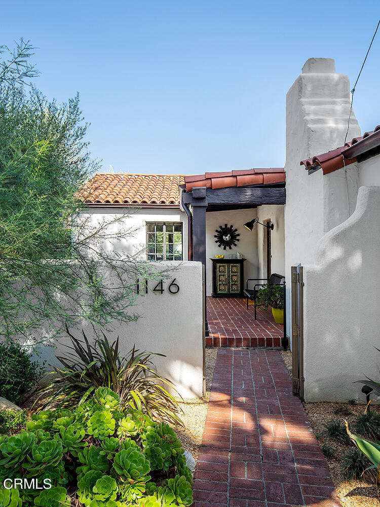 1146 Wotkyns Drive Pasadena, CA 91103 - Photo 4 of 63 a view of a patio with table and chairs and potted plants