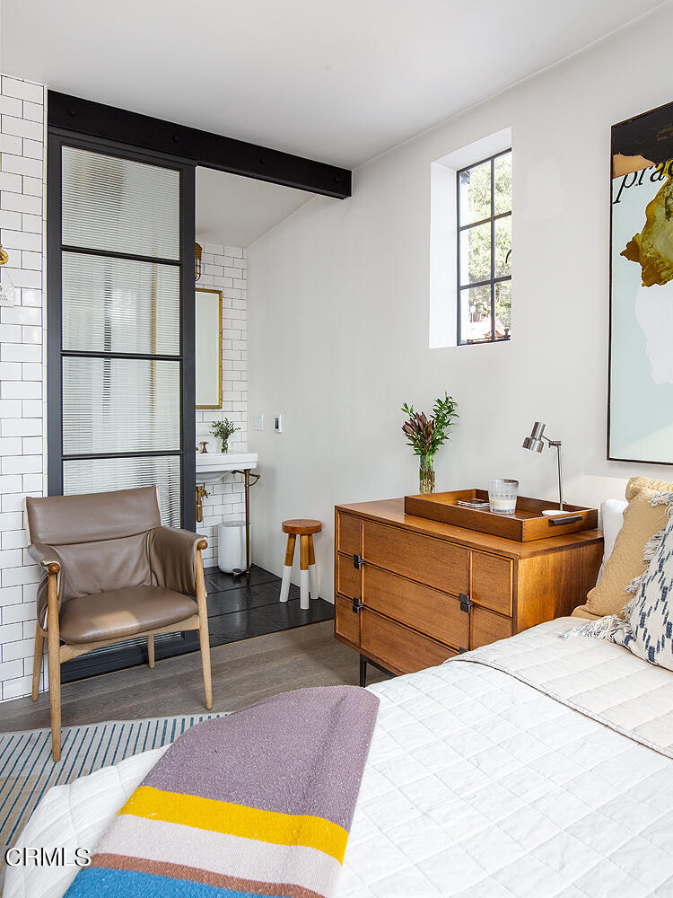 1146 Wotkyns Drive Pasadena, CA 91103 - Photo 41 of 63 a bedroom with a bed and a couch