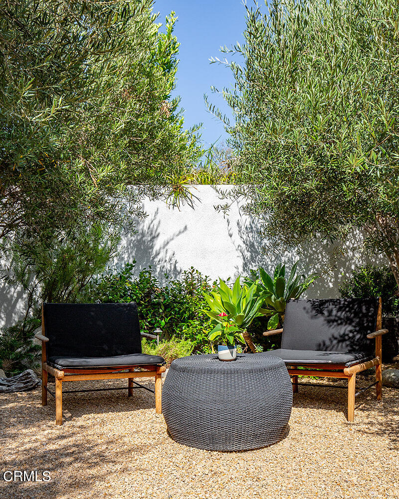 1146 Wotkyns Drive Pasadena, CA 91103 - Photo 50 of 63 a view of a backyard with plants and a fire pit