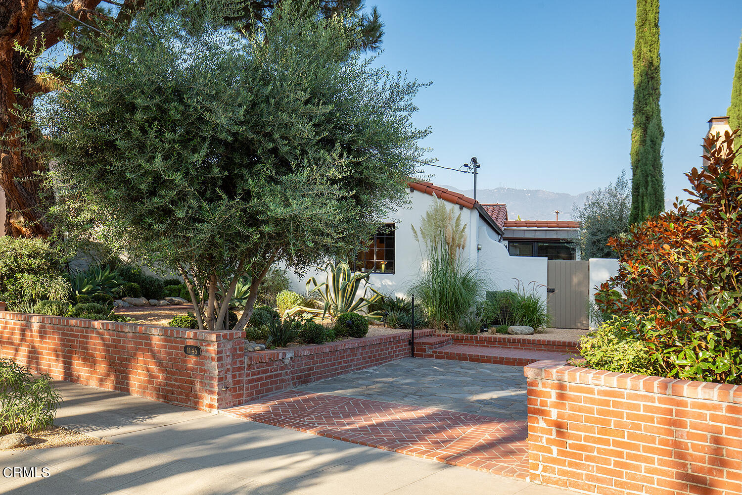 1146 Wotkyns Drive Pasadena, CA 91103 - Photo 52 of 63 a front view of a house with a yard