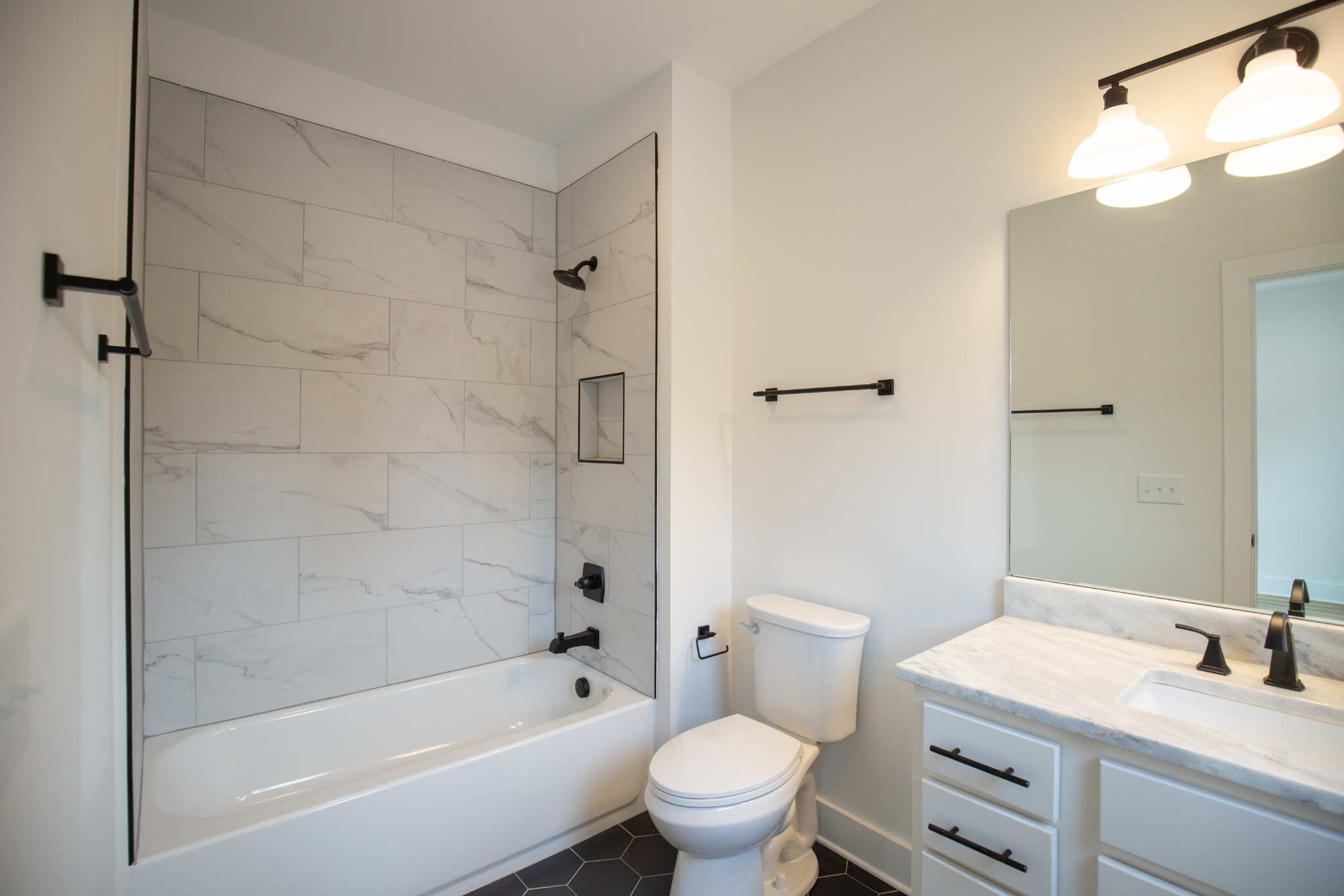 308 Larkin Springs Road Madison, TN 37115 - Photo 17 of 25 a bathroom with a sink a toilet and shower