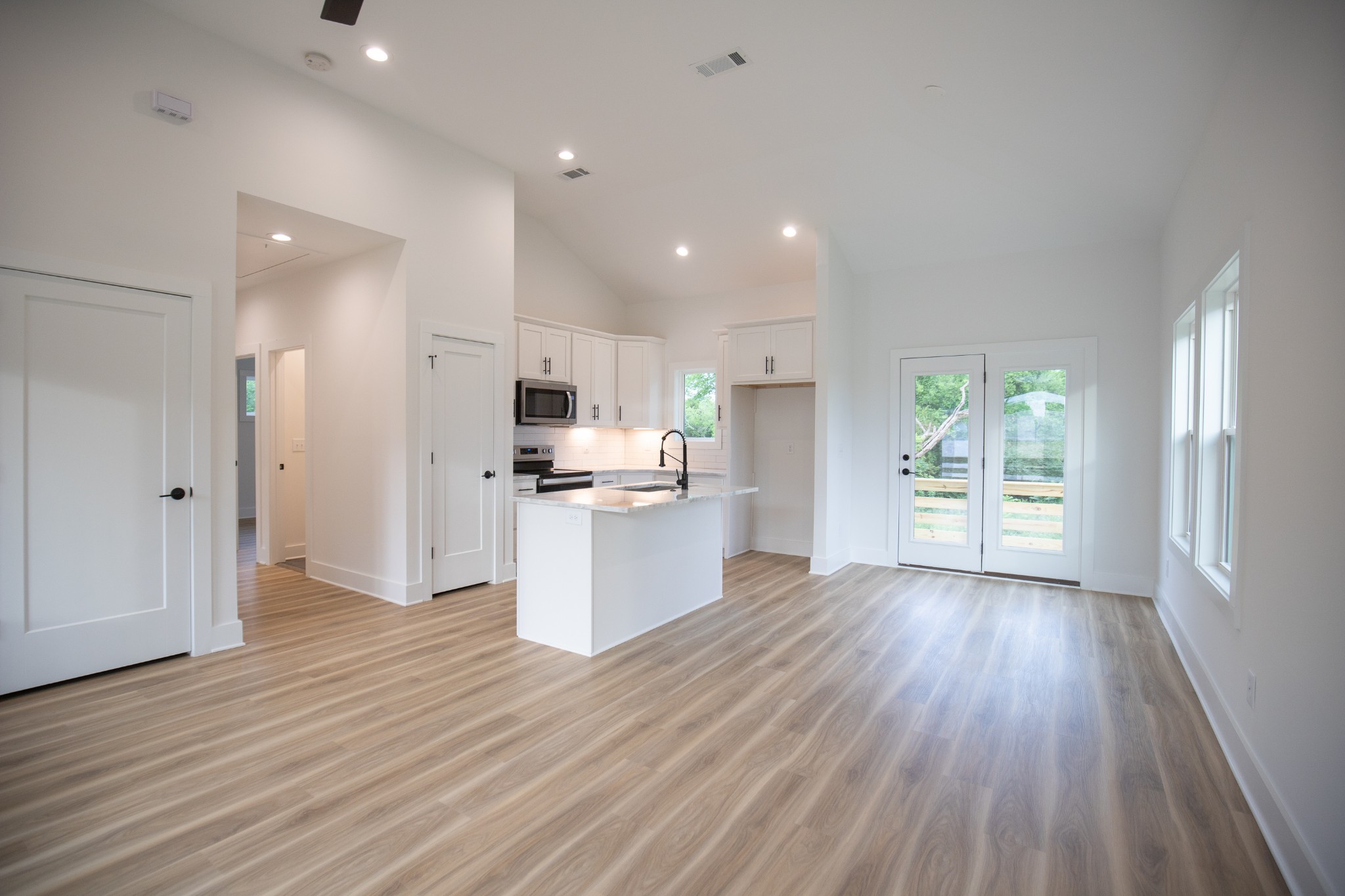 308 Larkin Springs Road Madison, TN 37115 - Photo 2 of 25 a view of a kitchen with wooden floor and a window