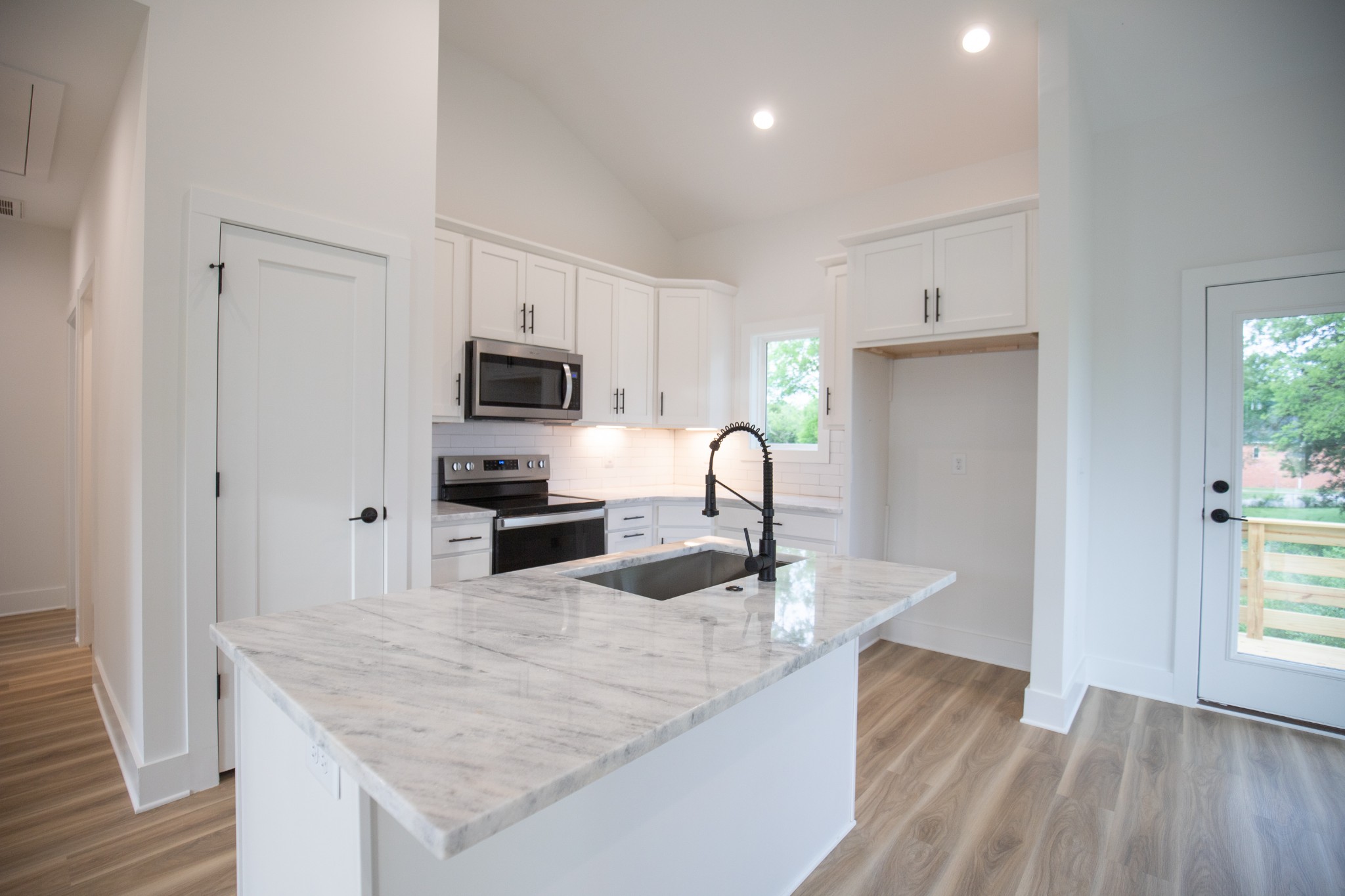308 Larkin Springs Road Madison, TN 37115 - Photo 6 of 25 a kitchen with granite countertop a sink a counter top space appliances and cabinets