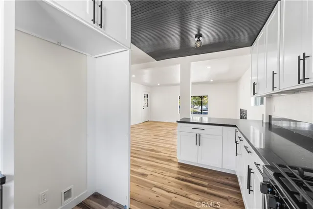 a kitchen with a sink cabinets and appliances
