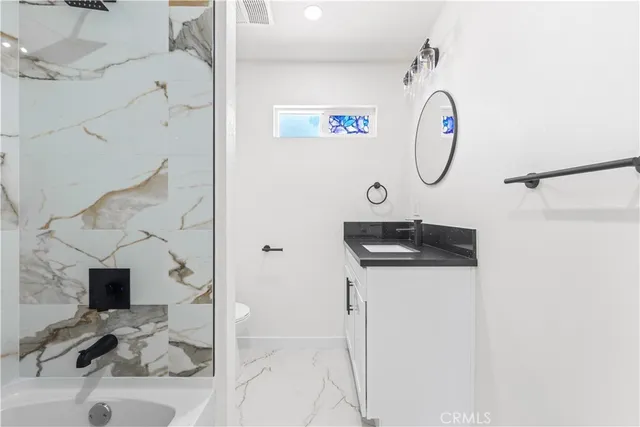 a sink and a clock on a wall