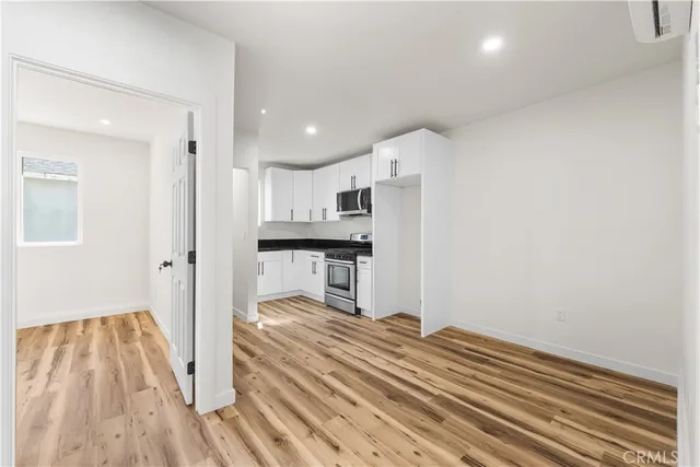 a view of kitchen and wooden floor