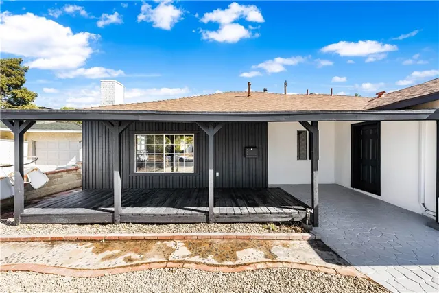 a view of a patio with a table and chairs