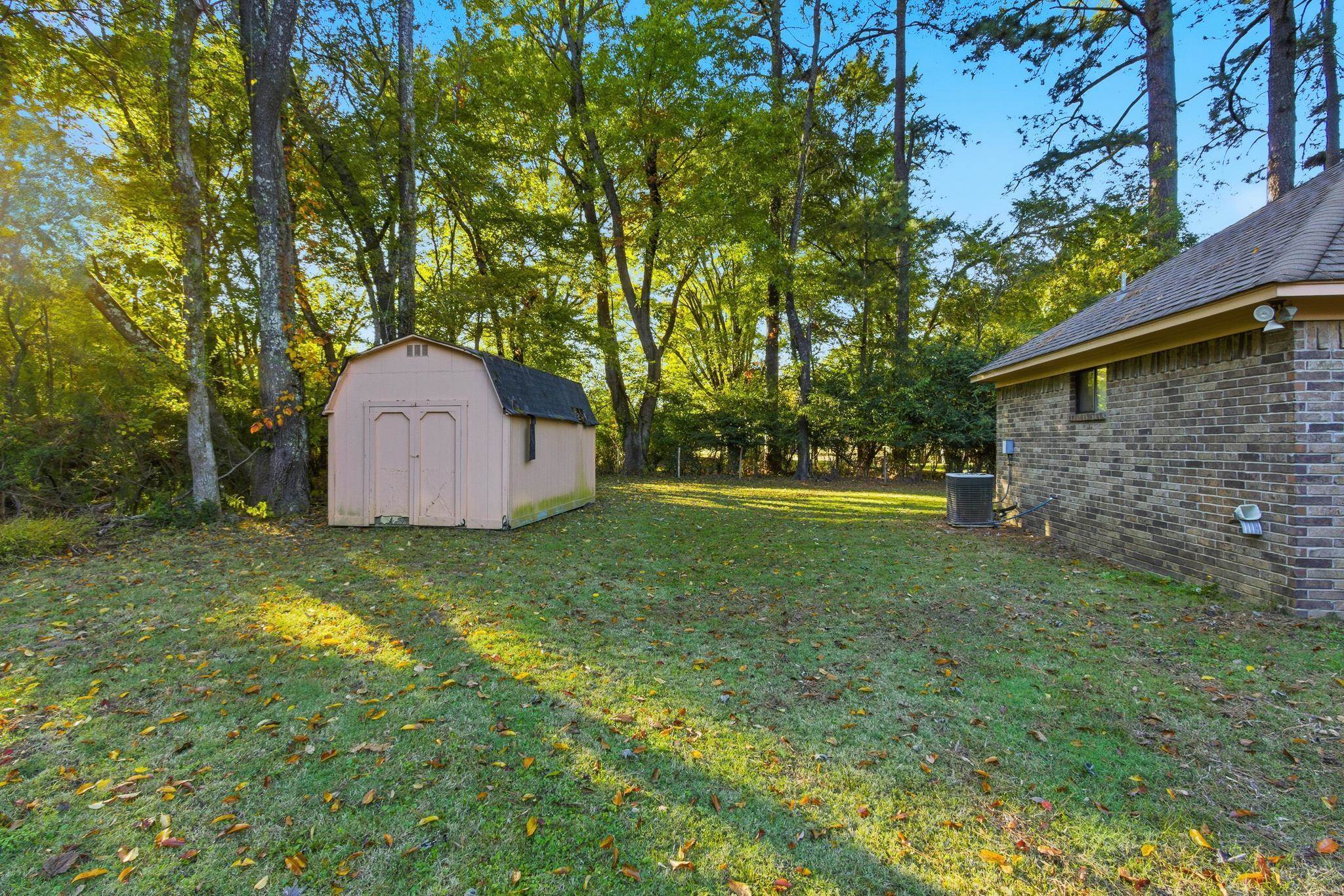 7281 Centralia Road Bartlett, TN 38002 - Photo 34 of 34 Great private backyard Storage building remains in as-is condition