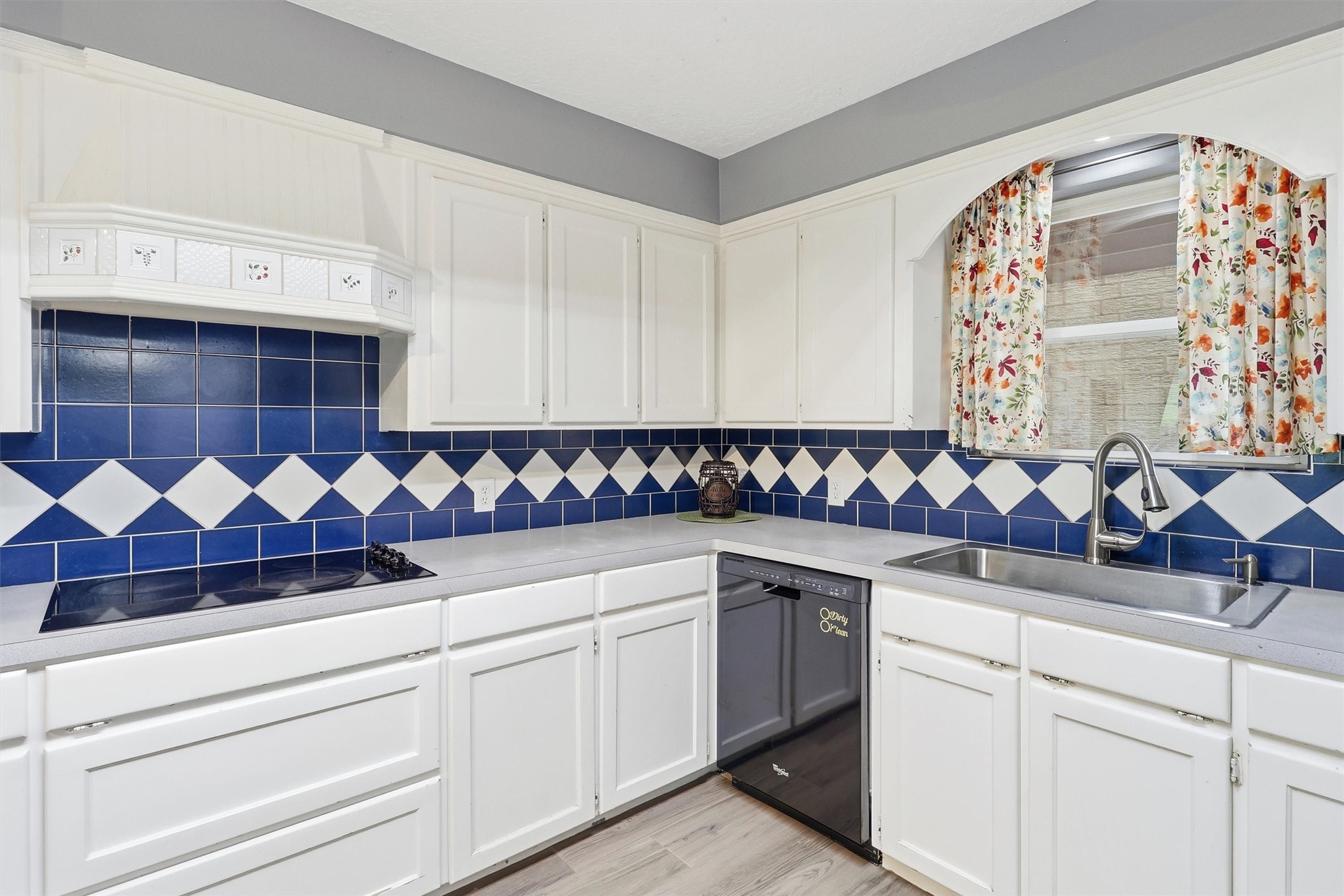 22923 Tomball Cemetery Road Tomball, TX 77377 - Photo 16 of 50 Love the bright white cabinets, custom vent hood with pretty accent tile and lots of storage!