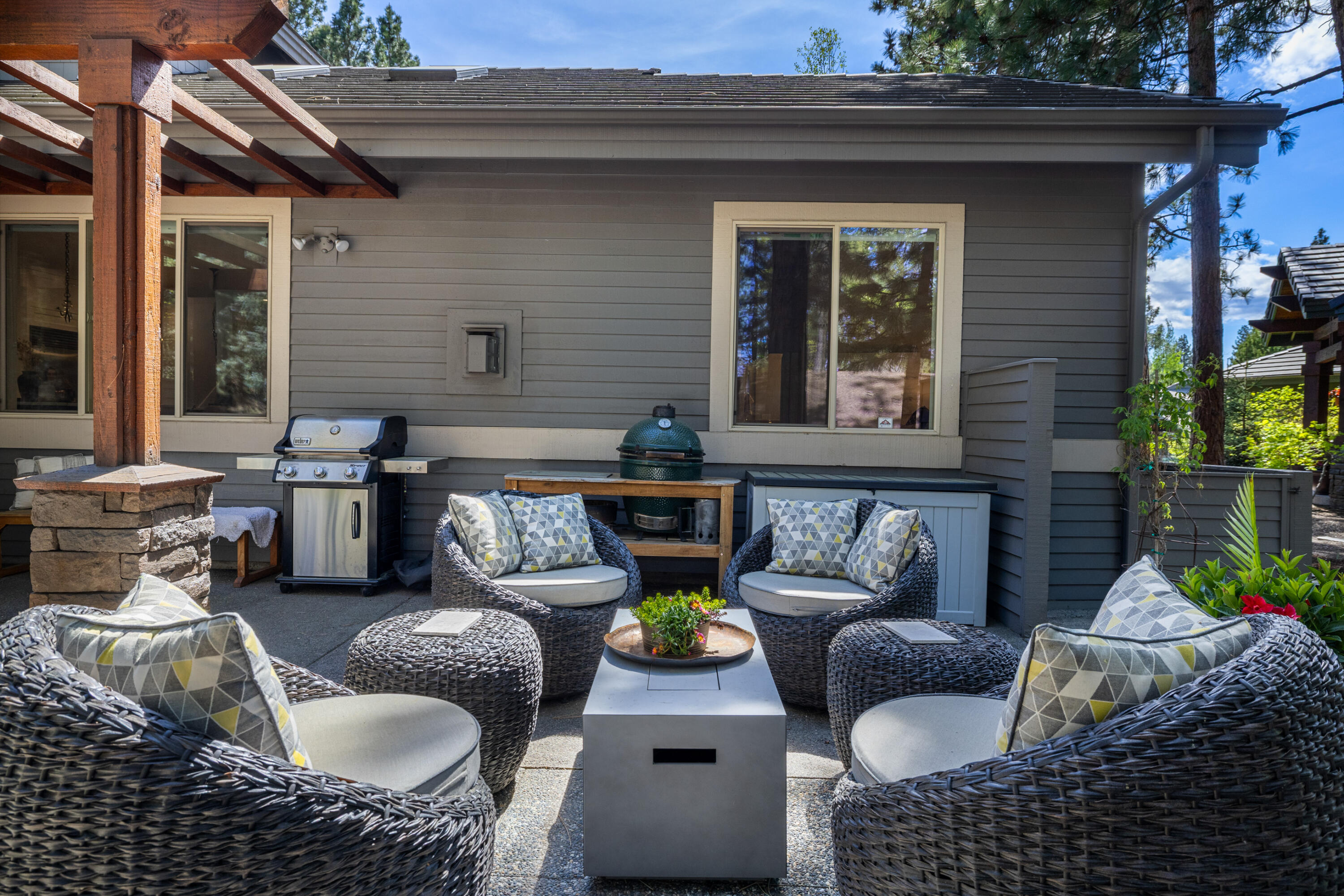 19460 Chip Shot Lane Bend, OR 97702 - Photo 48 of 56 Designed for easy entertaining, the patio includes space for grilling, dining and comfortable lounge seating beneath the pergola.