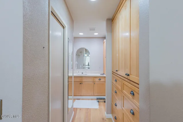 a view of cabinets with wooden floor and window