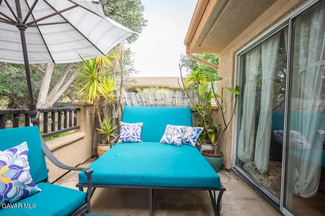 a view of an outdoor sitting area with furniture