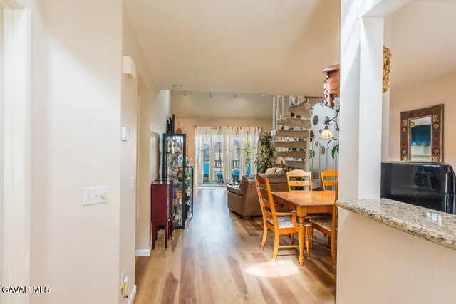 a view of a dining room with furniture and chandelier
