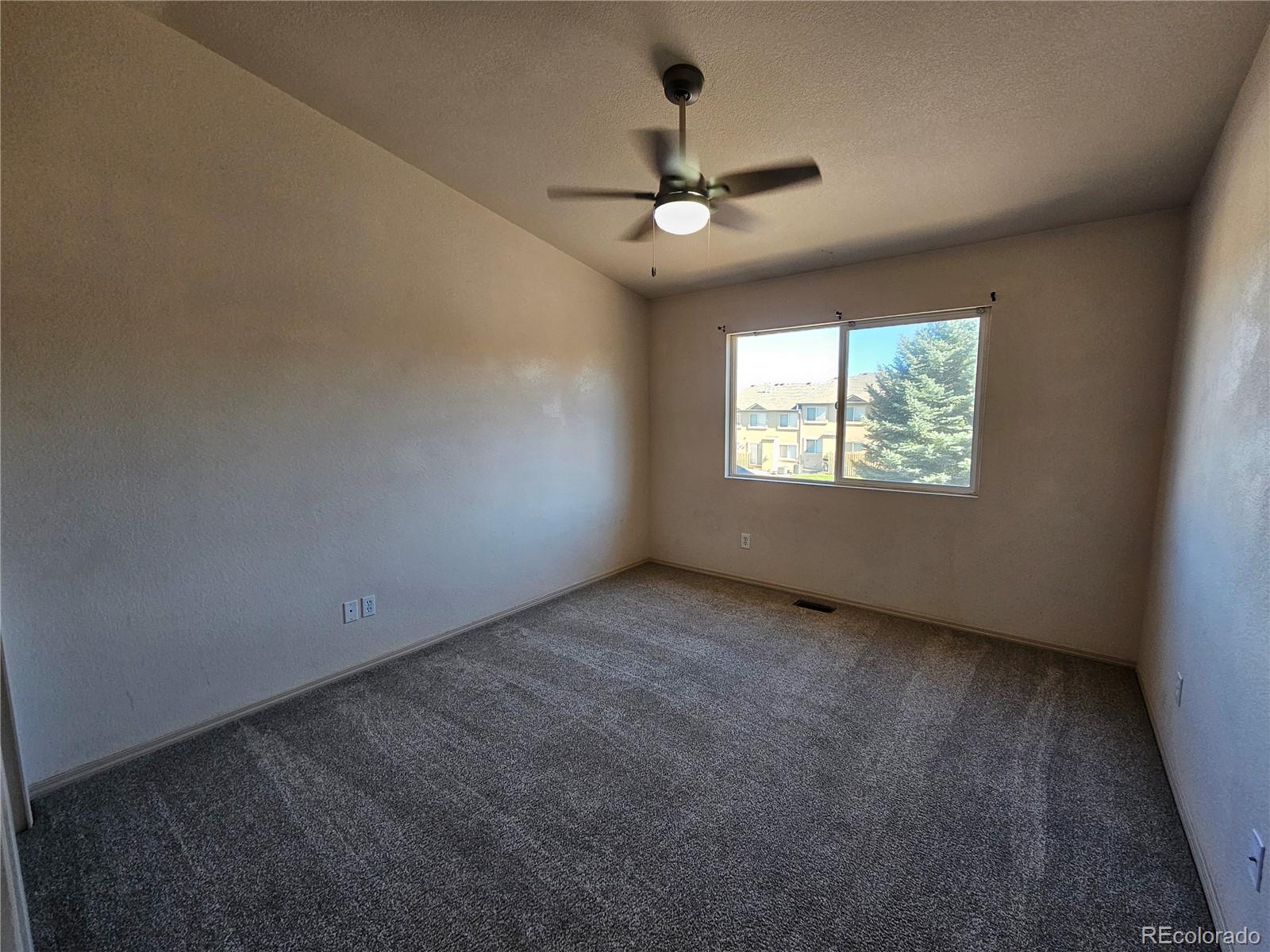 5638 Appalachian View Colorado Springs, CO 80918 - Photo 16 of 21 a view of an empty room with a window